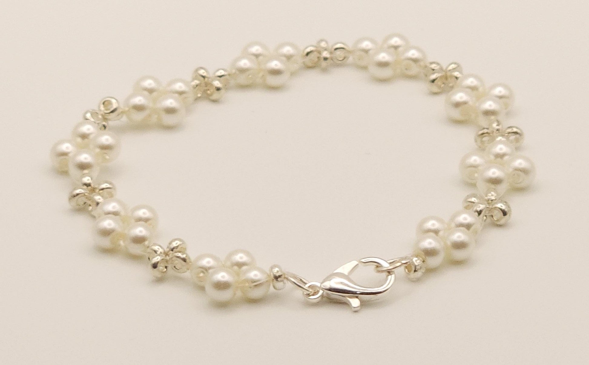 Sophisticated Silver and Pearl-Colored Plated Glass Beaded Bracelet